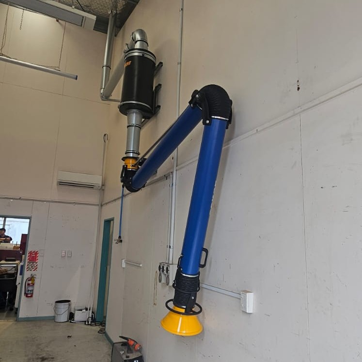 Effective Fume extraction using a fume arm, swung out of the way when not in use. Fumes are filtered here with a cylindrical in line filter.